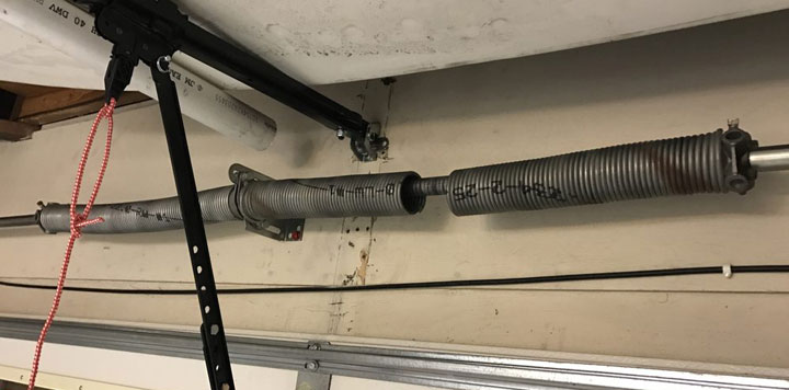 Broken garage door spring repair Monroe County